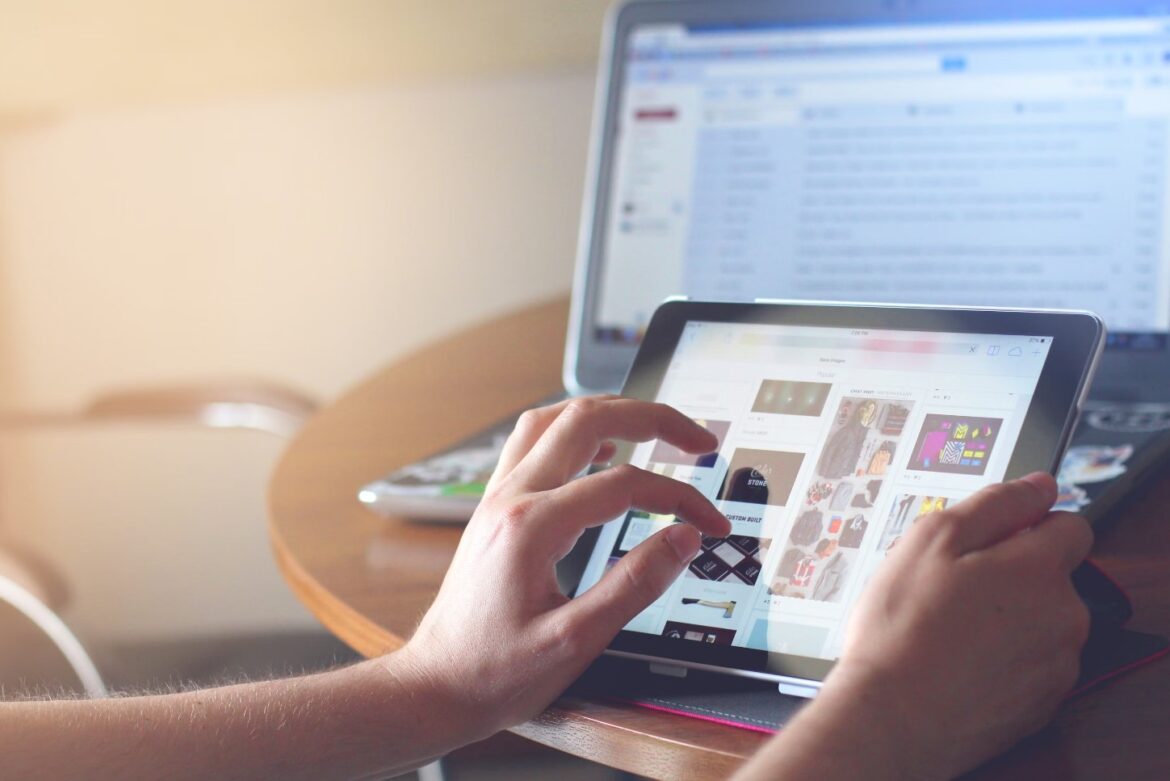 A person using a tablet Description automatically generated